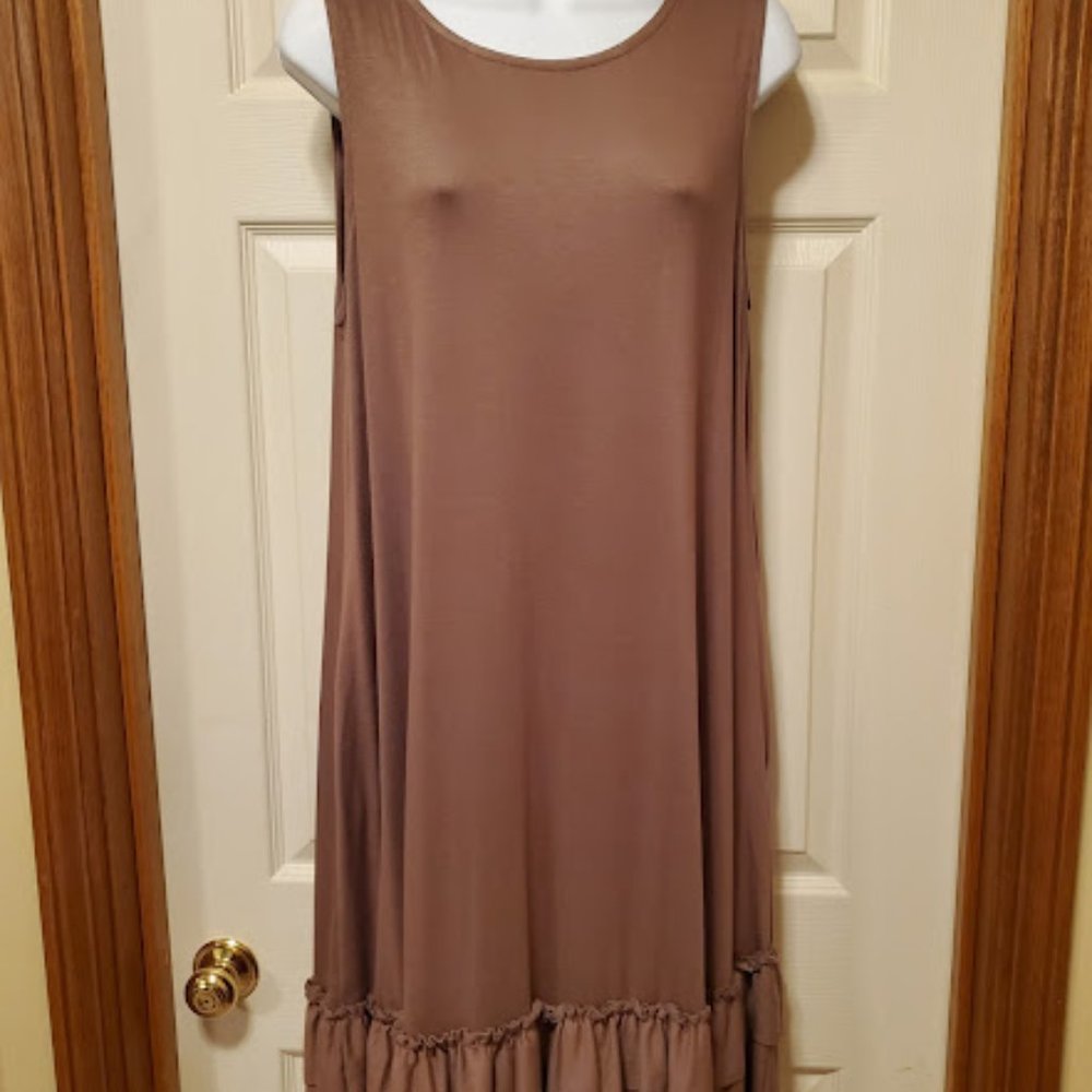 Light brown sleeveless dress with ruffled bottom